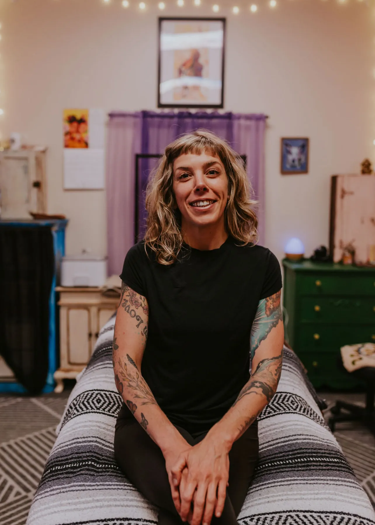 LeeAnna smiling in her massage studio